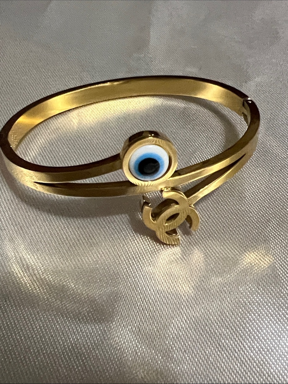 Gold-Tone Evil Eye Bangle Bracelet with Double-C Logo Charm